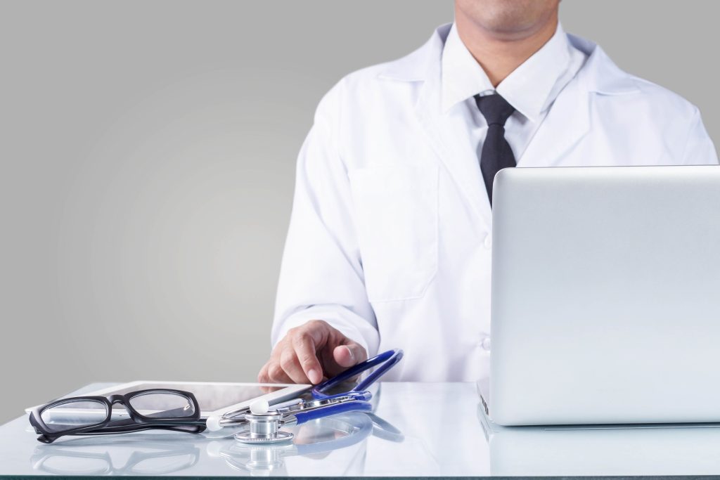 Doctor and equipment in office.